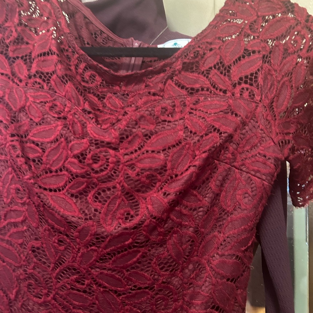 Lace fabric lined body contouring dresses